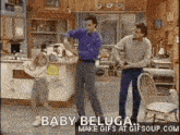 a group of people are dancing in a kitchen with the words baby beluga make gifs at gifsoup.com