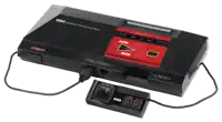 a sega master system video game console with a controller attached to it