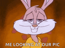 a cartoon bunny is looking at the camera and says `` me looking at our pic '' .