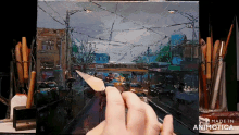 a painting of a city street is being made by animatica