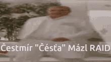 a blurred image of a man with the words cestmir " cesta " mazl raid written below him