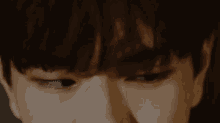 a close up of a person 's eyes with a tear coming out of it