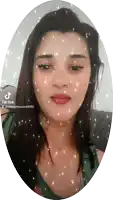 a woman 's face is surrounded by sparkles and says tik tok on the bottom right
