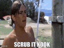 a shirtless man taking a shower with the words scrub it kook above him