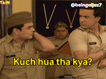 two police officers are standing next to each other with the words kuch hua tha kya on the bottom