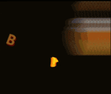 a jar of honey is being poured into the word bal