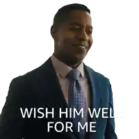 a man in a suit and tie has the words wish him well for me on his face