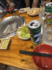 a can of up sits on a wooden table