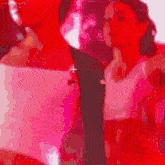 a group of dancers are dancing on a checkered floor in front of a red wall