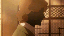 a silhouette of a person standing in front of a window with a grid pattern .