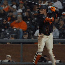 a baseball player with the number 5 on his back is running