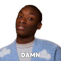 a man wearing a blue sweater has the word damn written on his chest