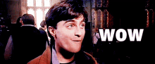 a close up of a person 's face with the word wow written in white