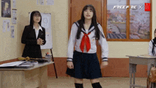 a girl in a school uniform is dancing in front of a sign that says free fire x