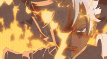 a close up of a person 's face with flames behind it