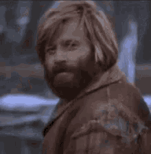 a man with a beard is saying i will