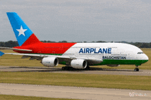 a red white and green airplane from balochistan