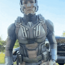 a man in a futuristic armor with the letter h on the chest