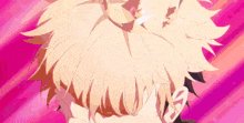 a close up of a person 's hair with a pink background