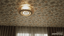 a room with a ceiling that has a floral pattern and the words made in animotica on the bottom