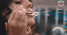 Lana Del Ray Blowing Bubbles GIF