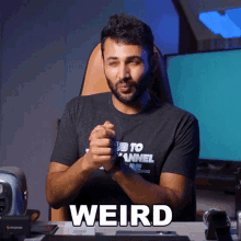 a man with a beard wearing a shirt that says ' us to channel re '