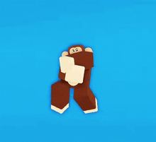 a monkey made out of blocks is standing on a blue background