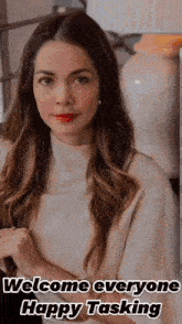 a woman with long hair and red lipstick is standing in front of a vase .