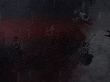 a large explosion with smoke coming out of it in a dark room .