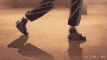 a person 's feet are shown in a gif with the website gifrun.com at the bottom
