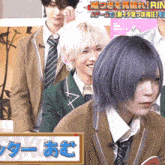 a man with purple hair is standing in front of a sign that says rin