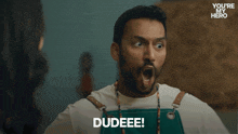 a woman says bruhhh in front of a man in a you 're my hero ad