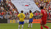two soccer players standing in front of a banner that says türkiye