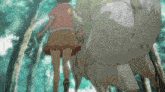 a girl in a skirt is walking in the woods next to a large animal