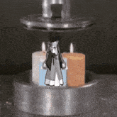 a candle holder with three candles in it
