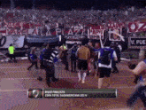 a soccer game is being played in a stadium with a banner that says river finalista copa total sudamericana 2014