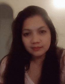 a close up of a woman 's face with long hair