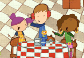 a boy wearing headphones sits at a table with two other girls