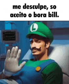 a man in a hospital bed wearing a luigi costume