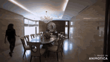 a woman walking into a dining room with the words made in animotica on the bottom