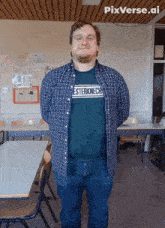 a man wearing a shirt that says esterkniech is standing in a classroom