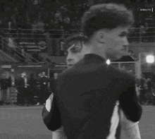 a black and white photo of a soccer player wearing a miami shirt