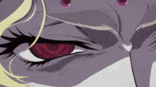 a close up of a woman 's eye with a yellow glow