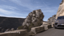 a car is driving down a road with motorweek.org written on the bottom right