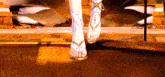 a woman 's feet are shown in a video game while wearing white sandals