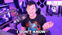 a man wearing headphones and a shirt that says i don t know
