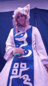 a woman in a blue and white dress with chinese writing