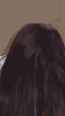 a close up of a person 's face with a white shirt on