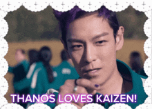a man with purple hair and the words thanos loves kaizen