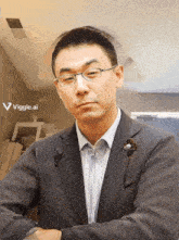 a man in a suit stands in front of a viggle.ai logo